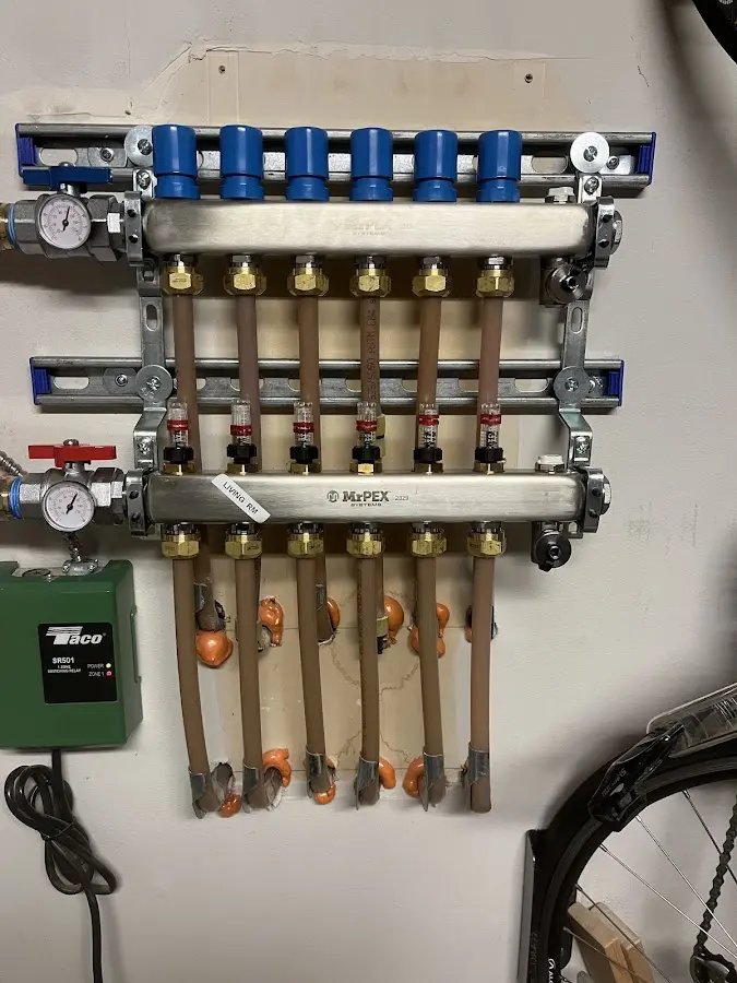 Plumber performing Water Heater Repair at a residential property in Canisteo